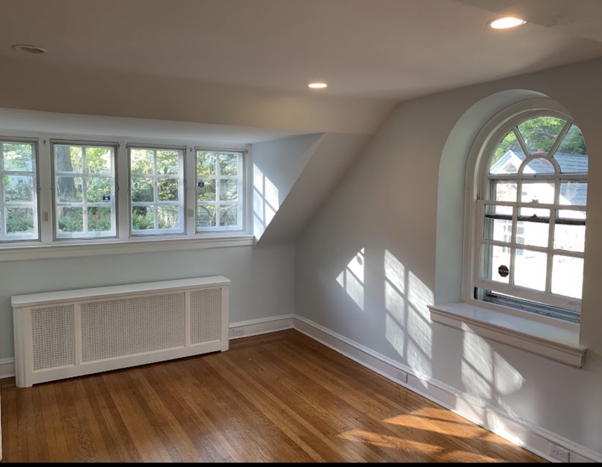 Light neutral painted room with arched window